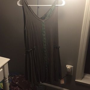 green sleeveless top